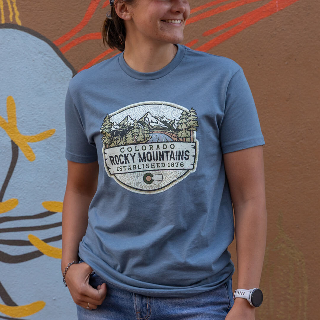 Woman wearing Colorado Rocky Mountains tee shirt.