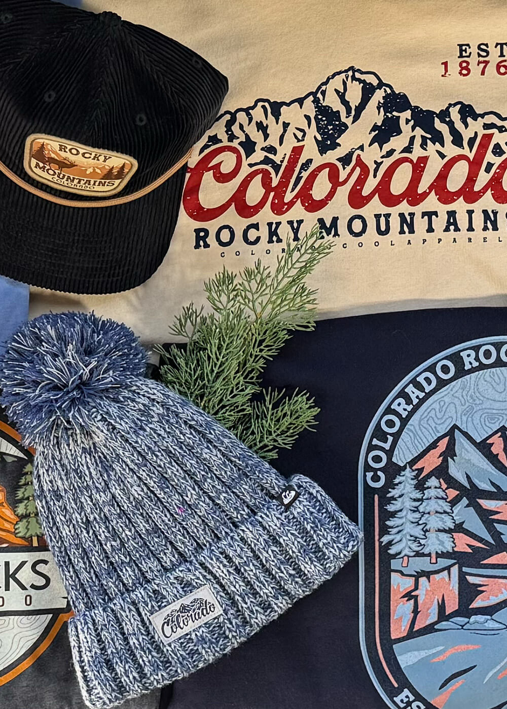layout with a variety of colorado hats, tshirts, and beanies